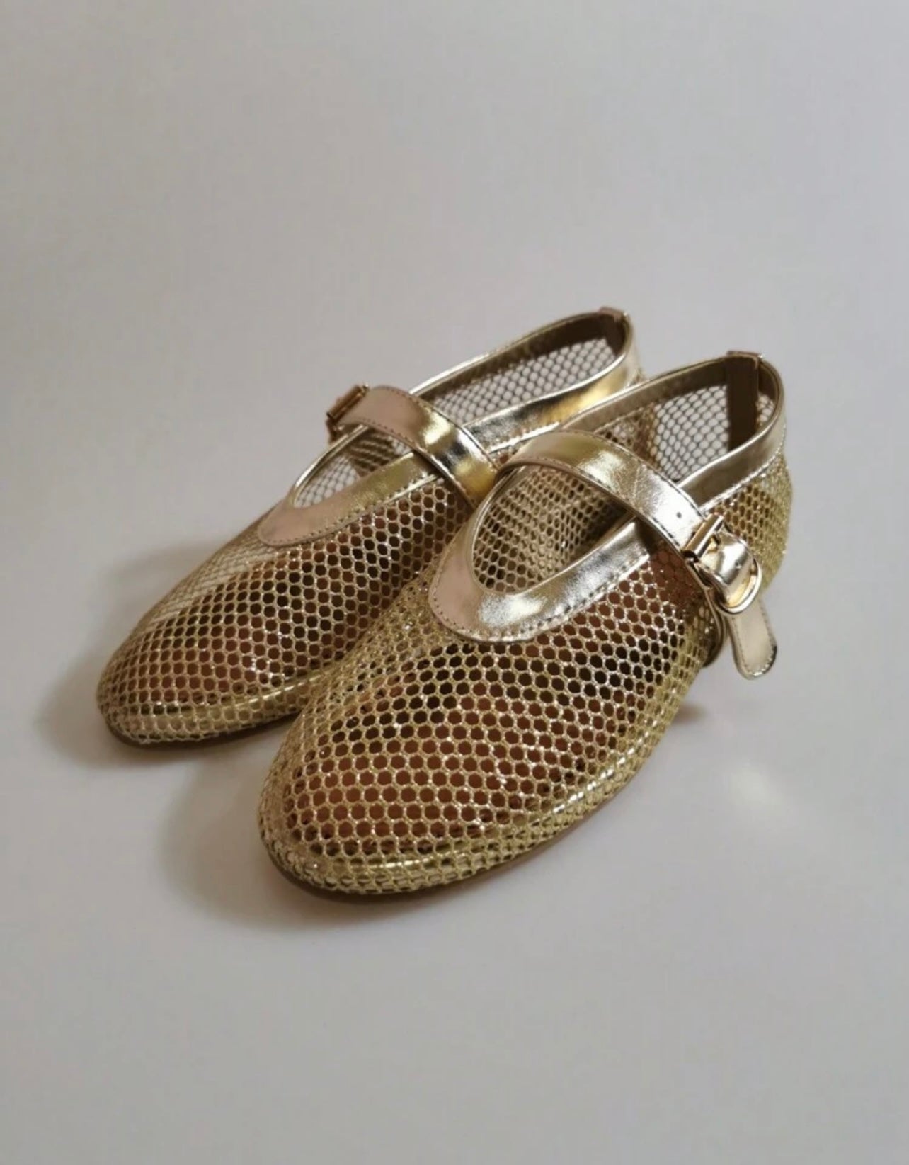 Gold flat ballerinas